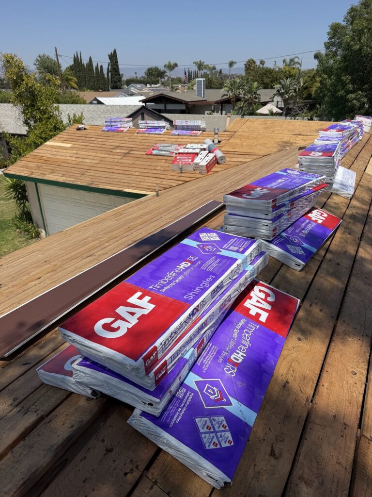 GAF shingle bundles staged on the roof deck during a Simi Valley roof replacement by Infinity Roofers