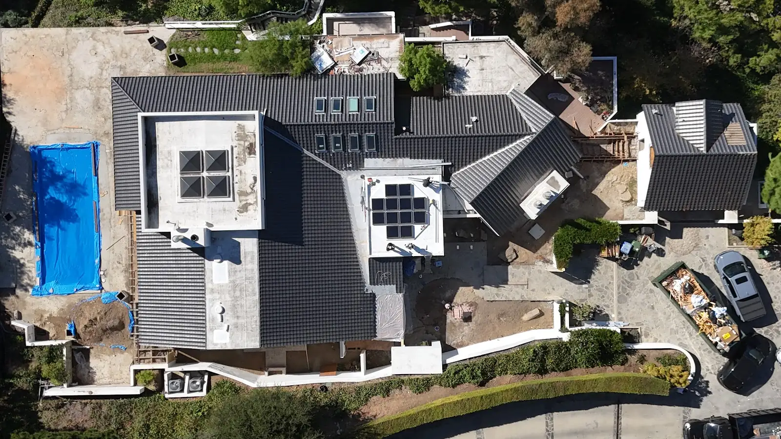 Drone view of a home and its roof taken to plan the roof work