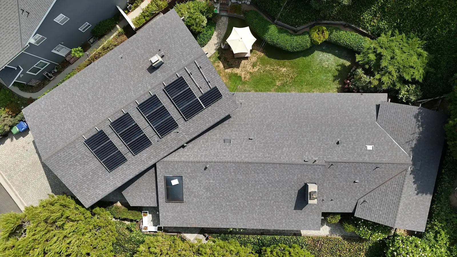 Shingle roof with solar panels on a home, an Infinity Roofers job