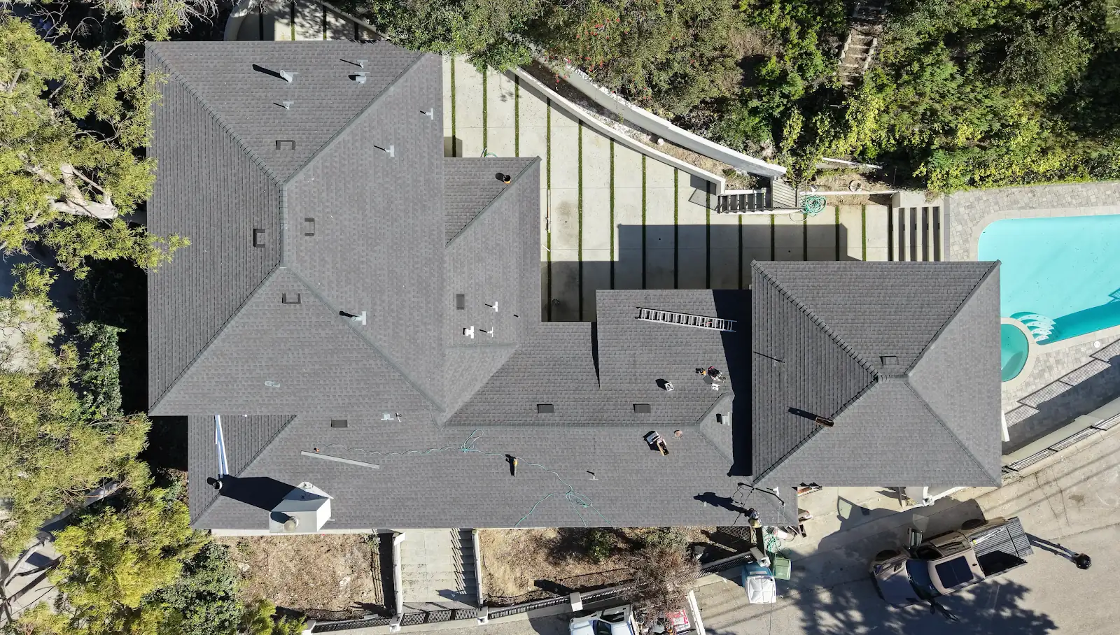 Shingle roof on a multi-hip home, an Infinity Roofers job, aerial view