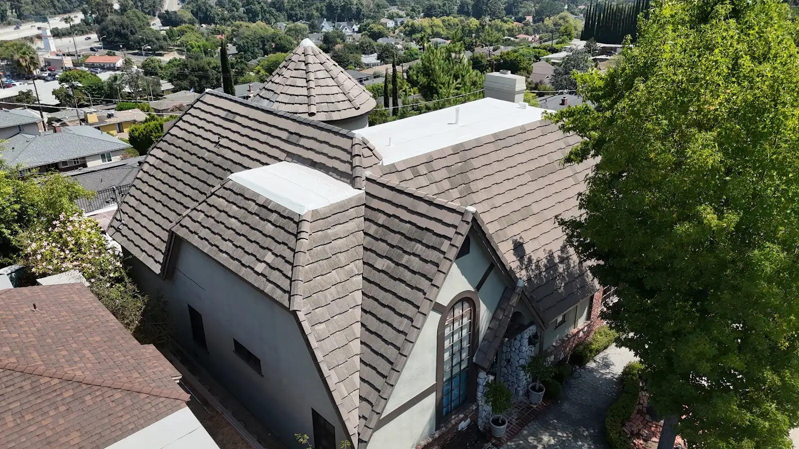 Concrete tile roof on a two-story home, an Infinity Roofers job